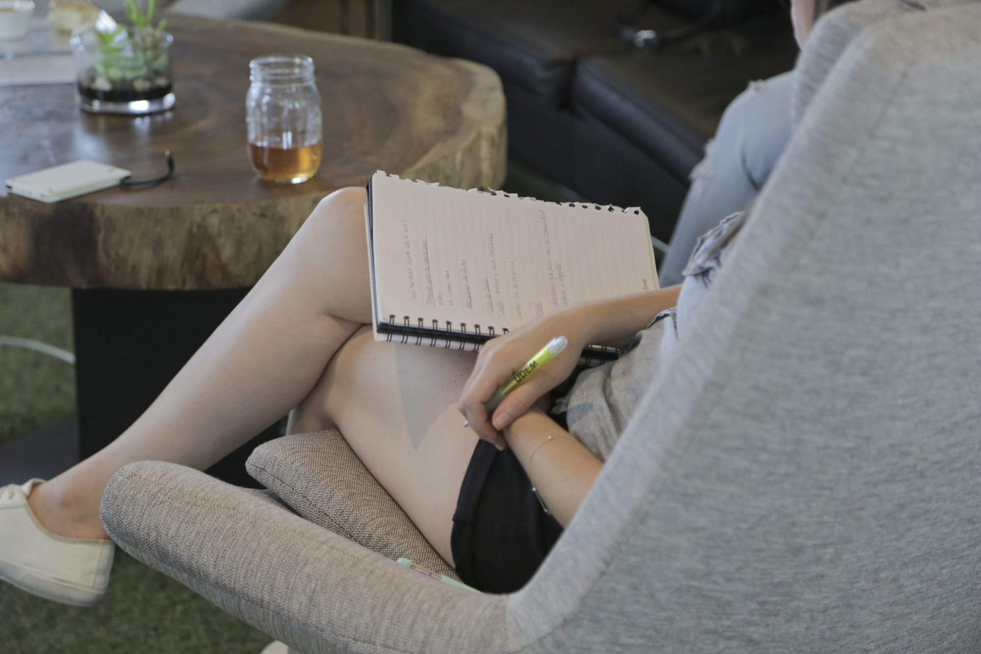 Woman taking notes on journal 