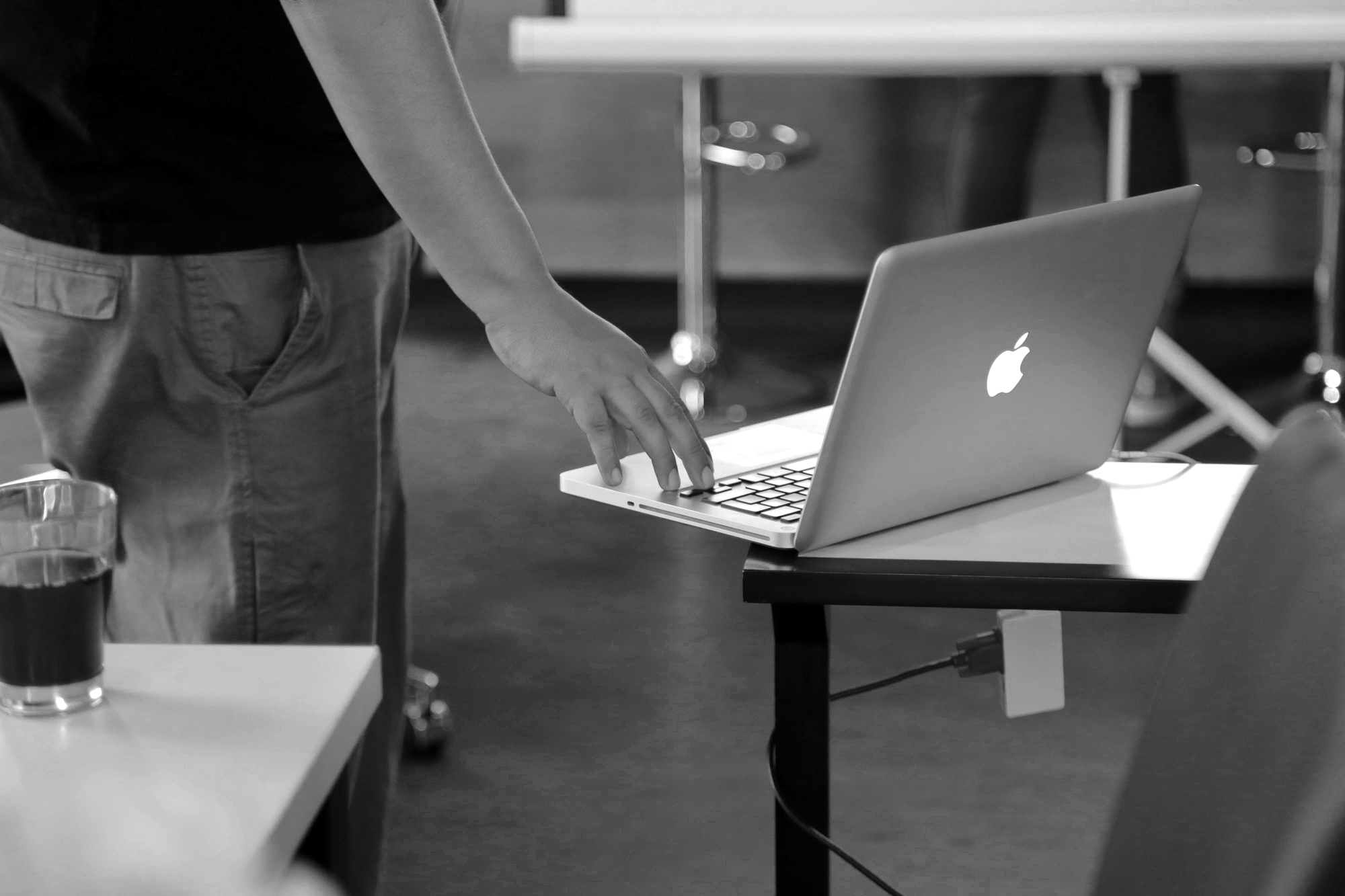 Man playing presentation on his macbook