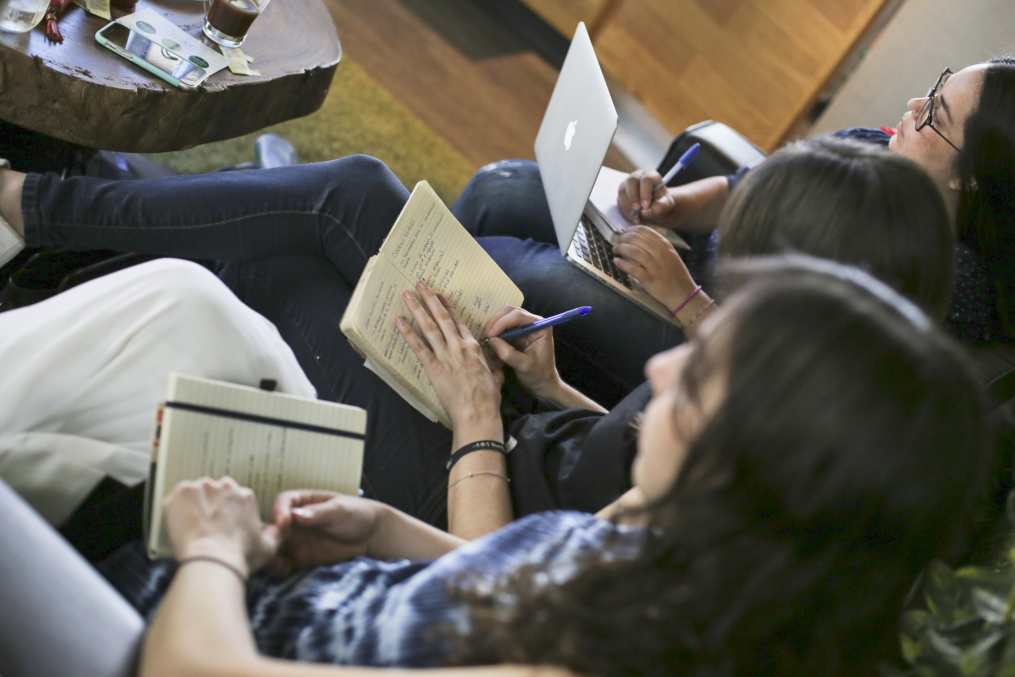  People taking notes during business presentation