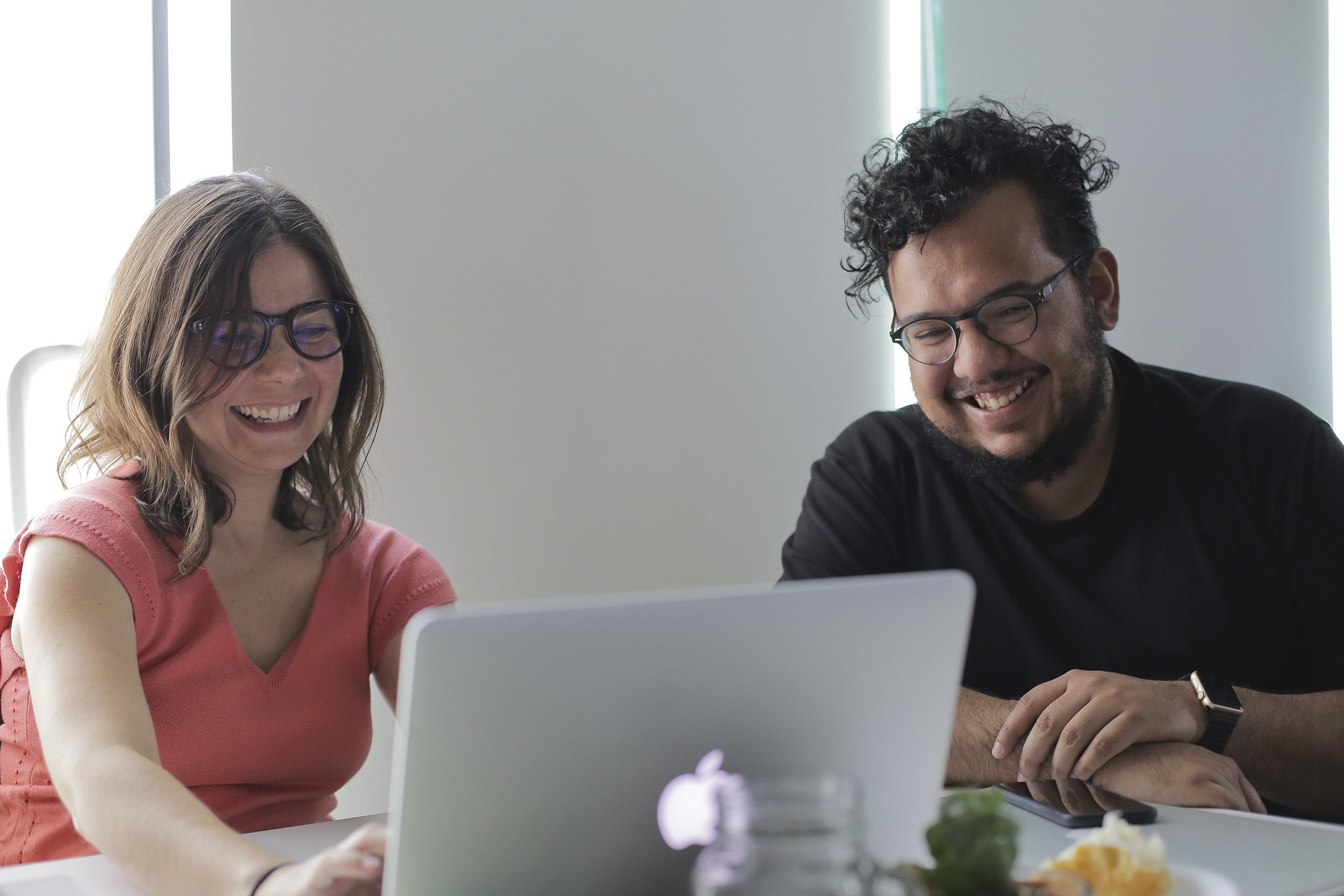 Colleagues laughing while working