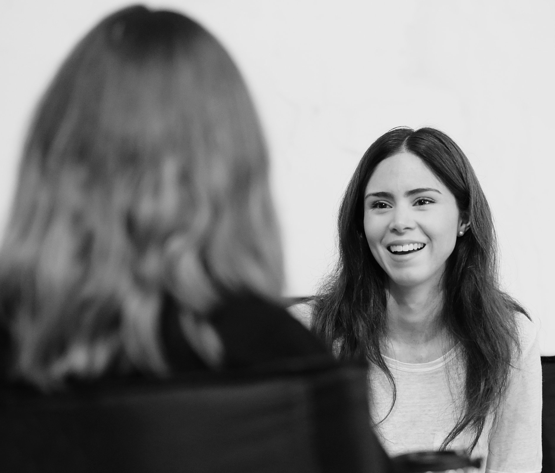 Woman laughing in business meeting
