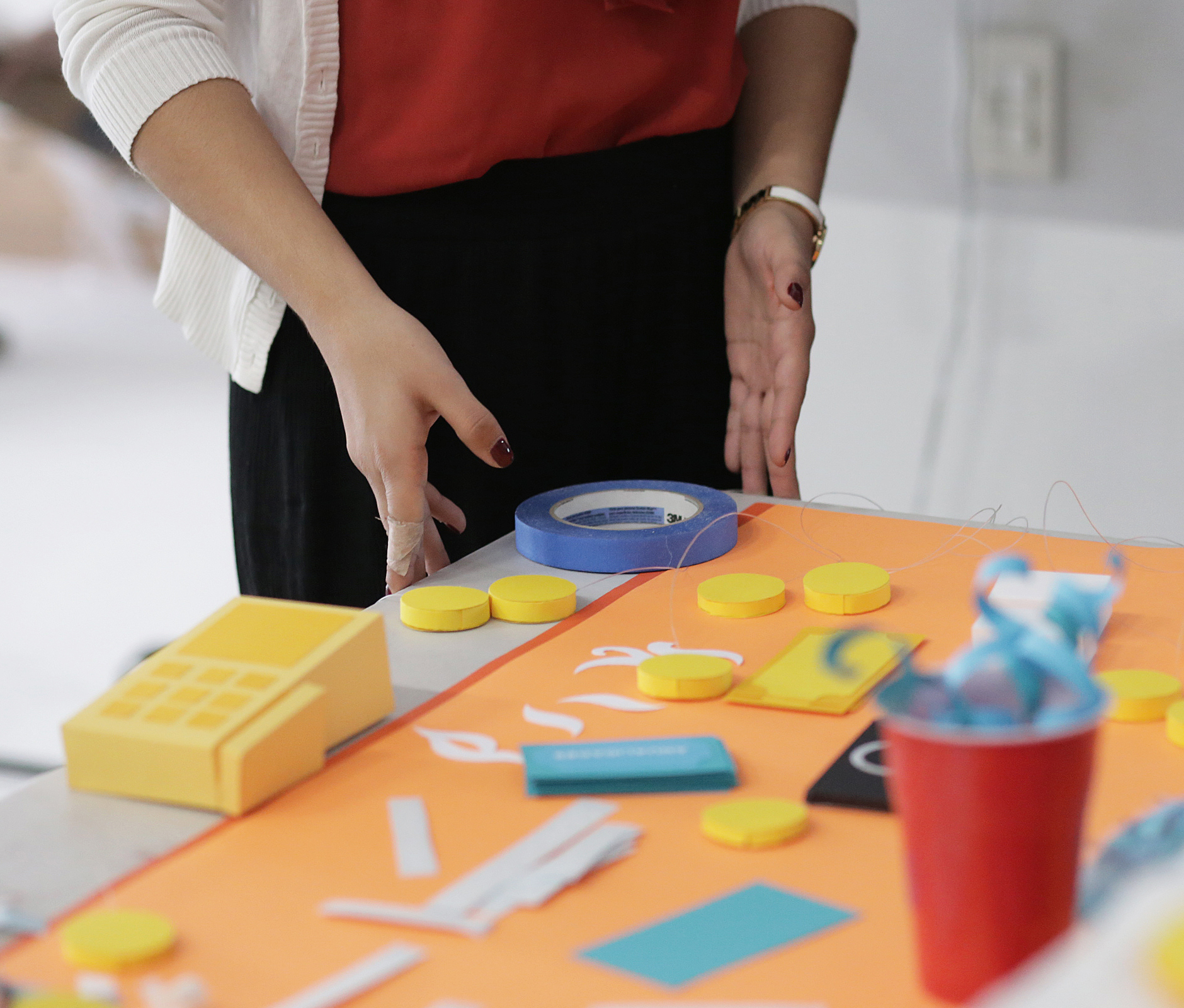 Woman revising table full of crafts