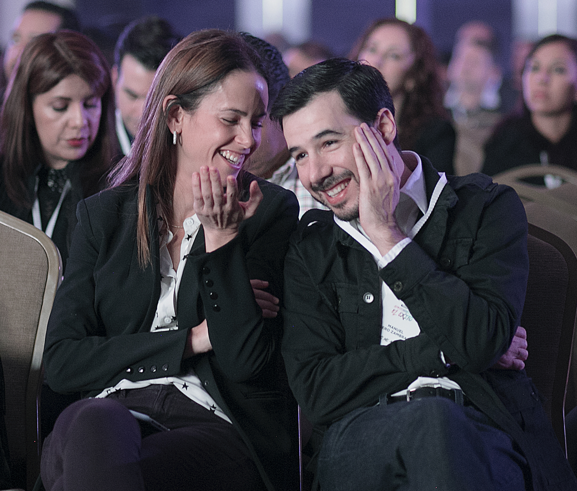 Couple laughing in the crowd
