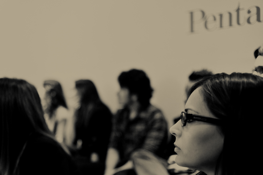 Woman with glasses in the crowd