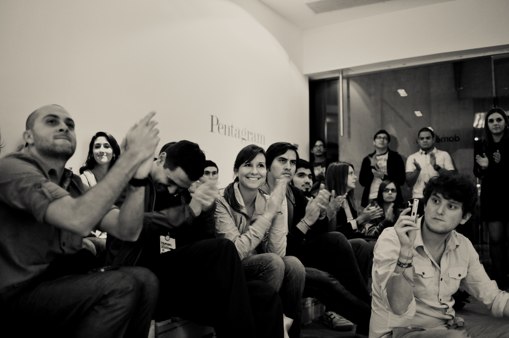 Crowd clapping at design conference