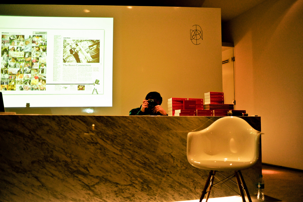 Photographer peaking over table