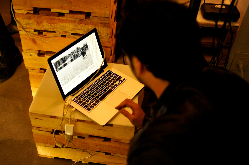 Man using computer at cafe