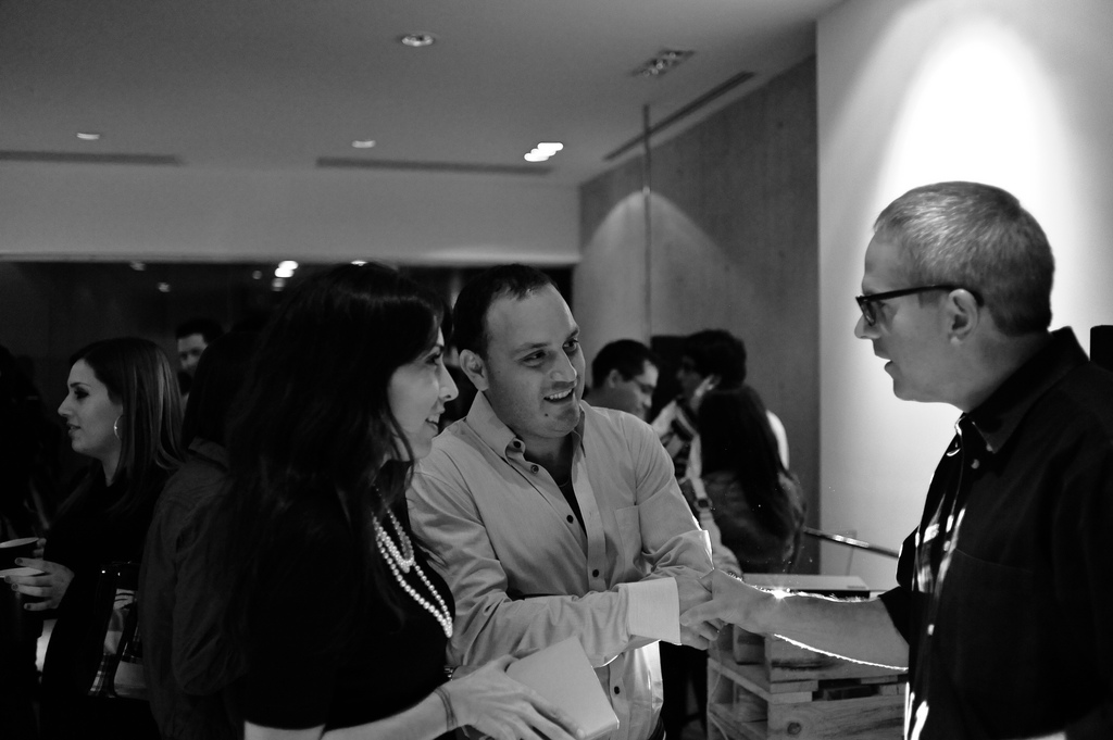 Man and woman talking at book event