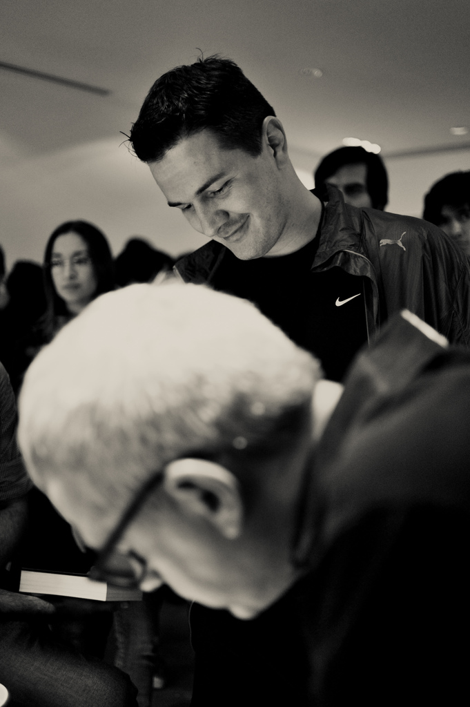  Man while his book is being signed