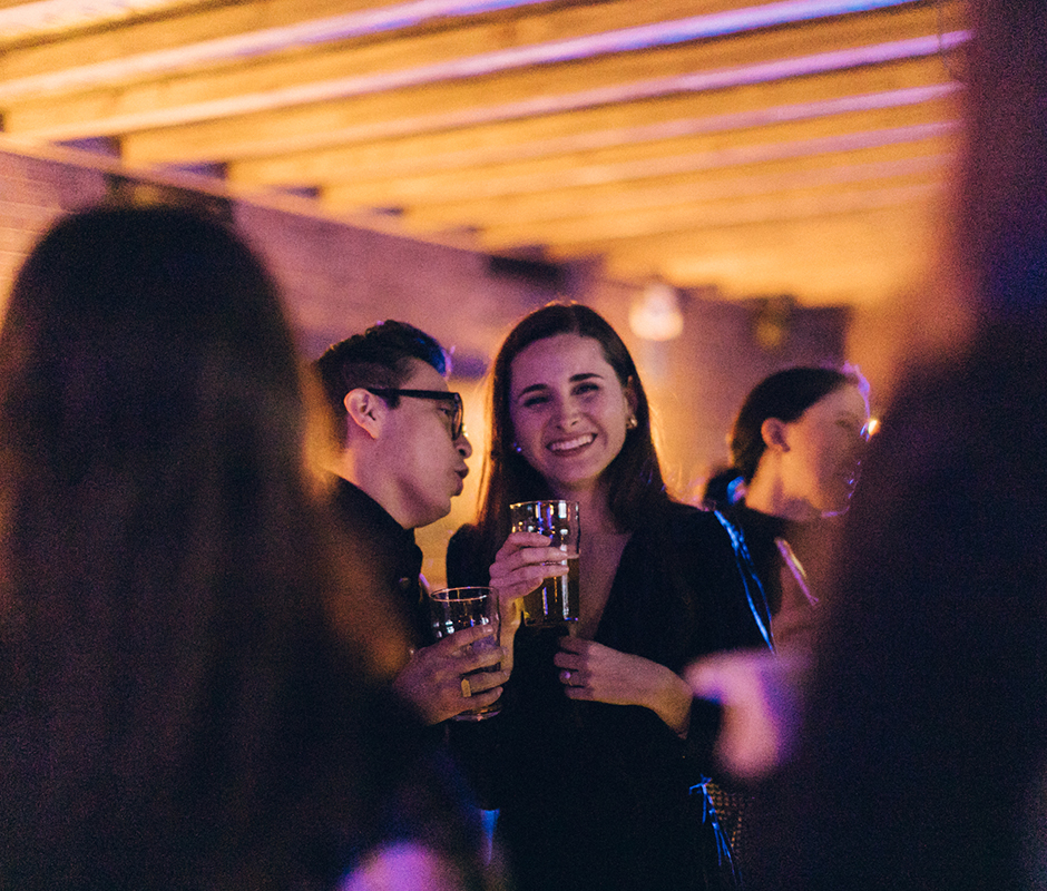 Friends laughing together at party