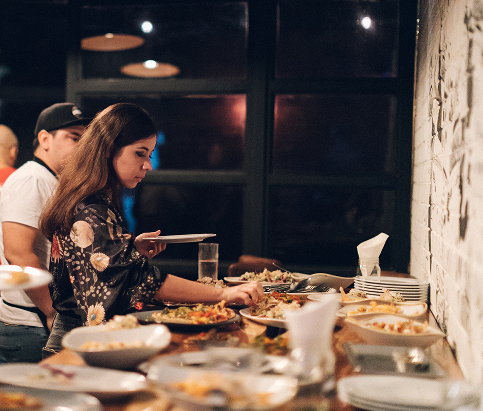  Woman serving her plate at buffet