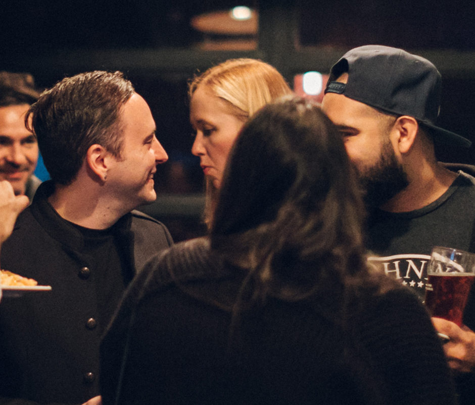 Friends talking at party