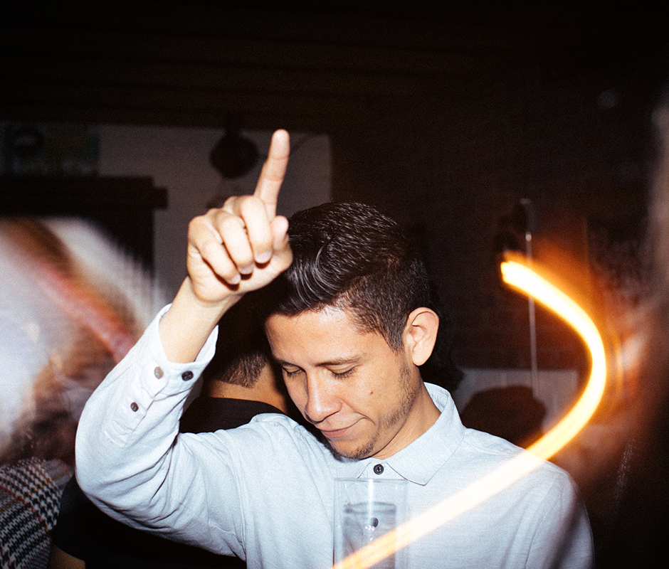 Man photographed dancing with camera flare