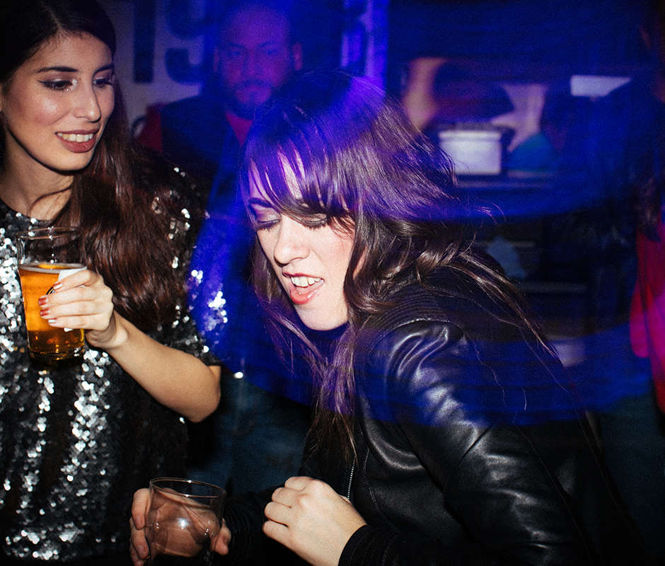 Woman dancing hard at a party