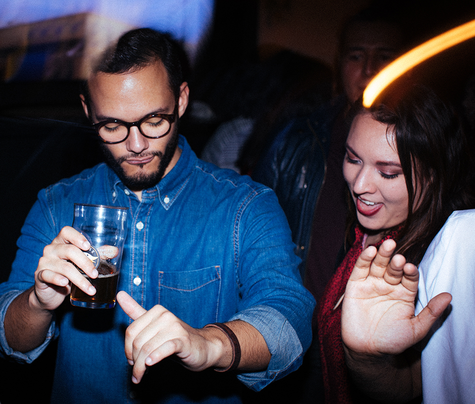 Friends dancing at bar