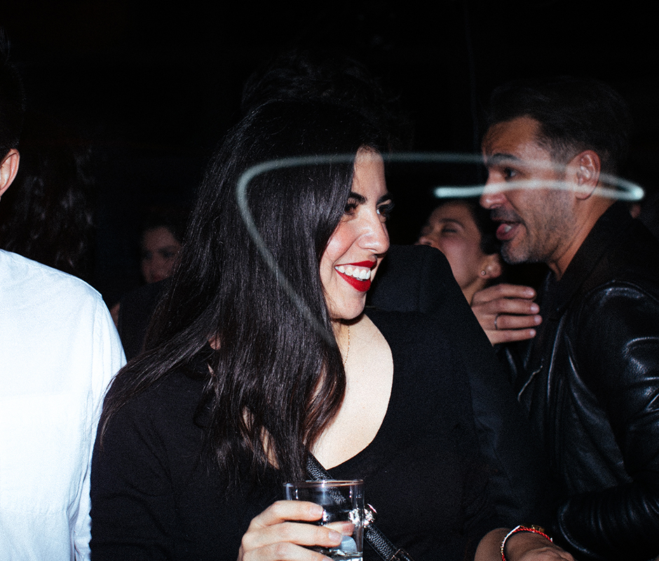Woman smiling in a bar