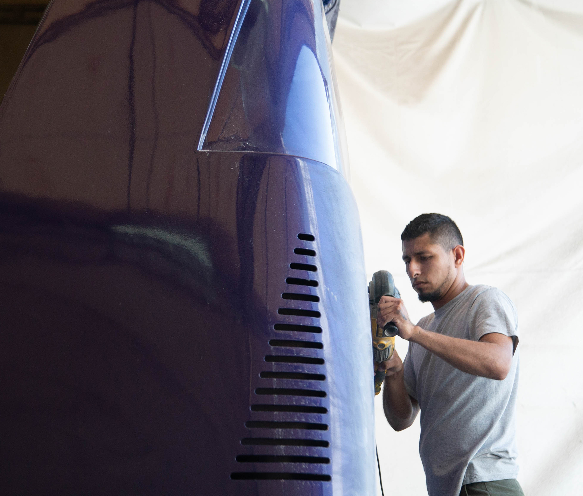 Man cleaning travel bus