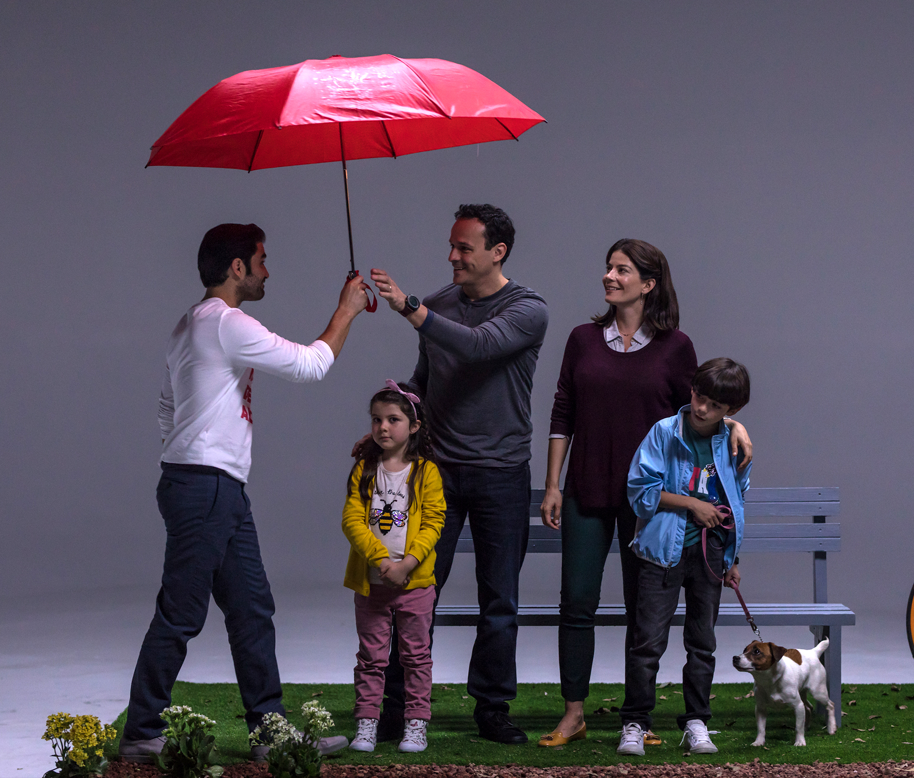 Commercial filming in stage showing family in a park set
