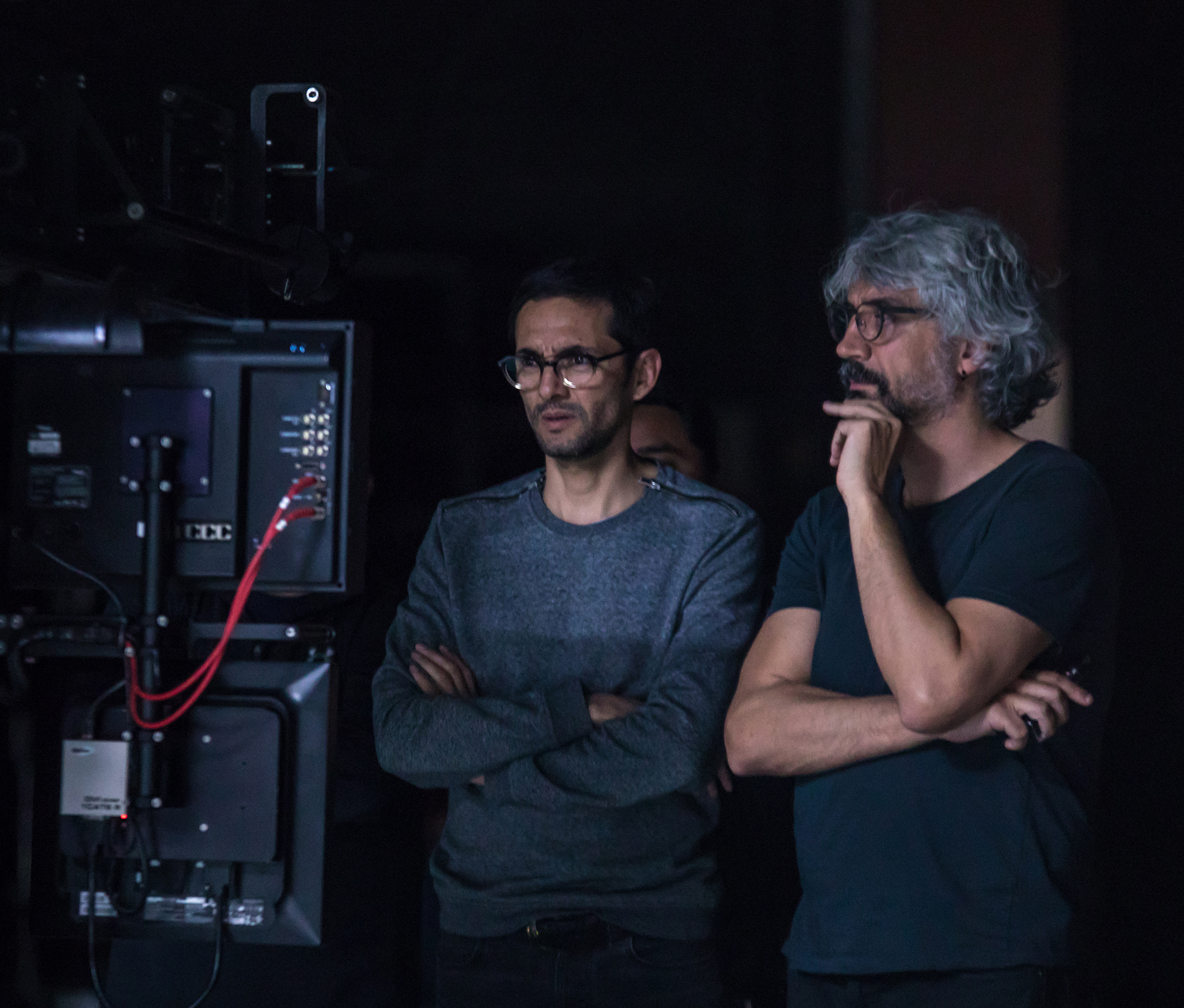 DoP and director watching camera monitor