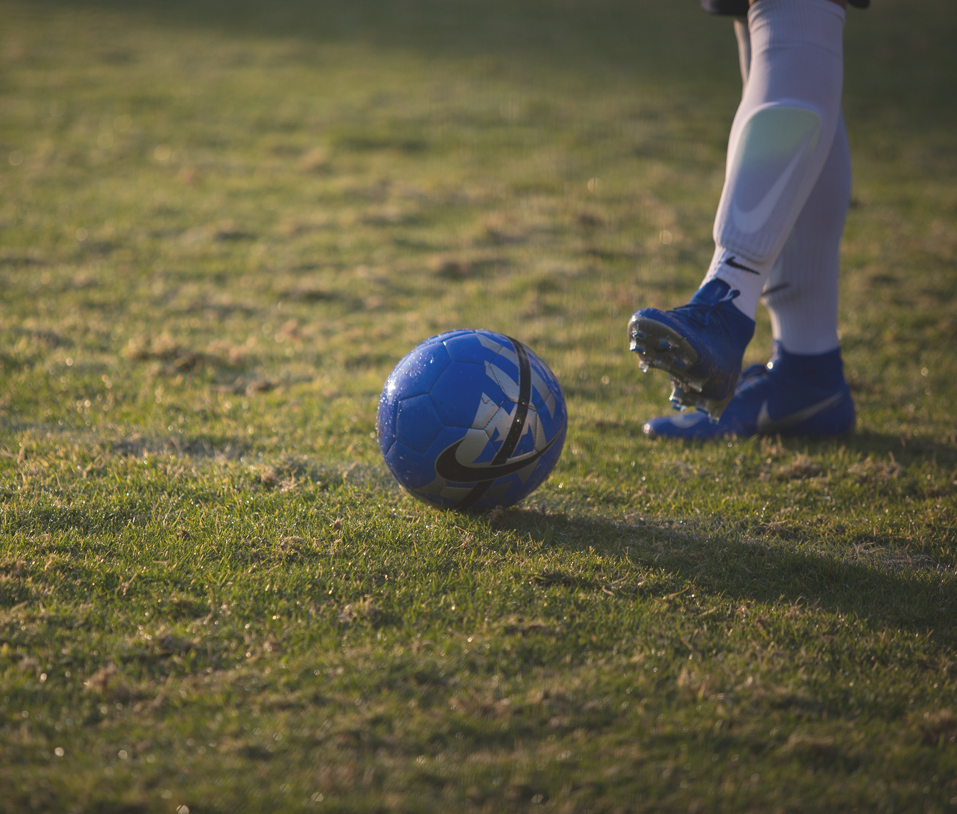 Nike blue soccer ball in field
