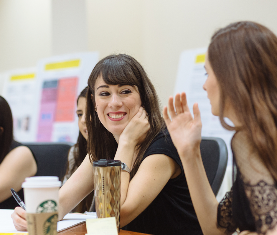 Woman smiling at her colleague