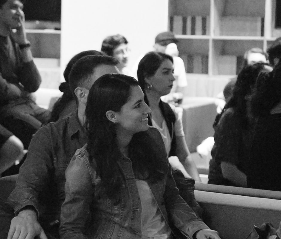 Woman listening to speaker at design events