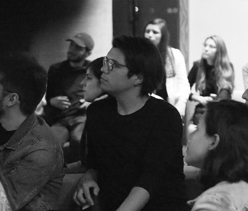 Man in the crowd listening to speaker