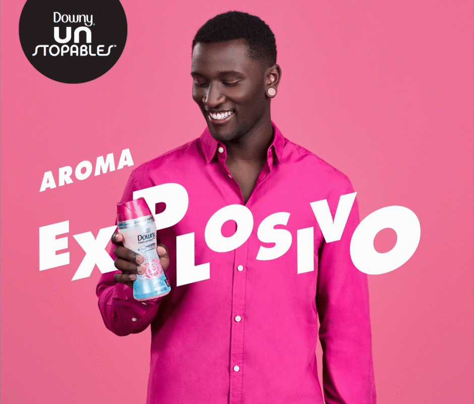 Male model holding Downy Unstoppable bottle for publicity ad