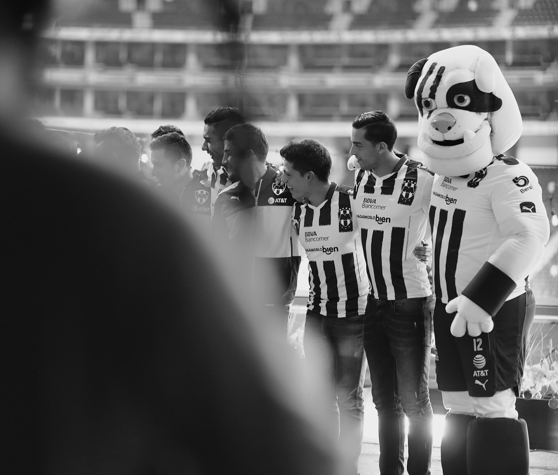 Soccer team and mascot photographed in black & white