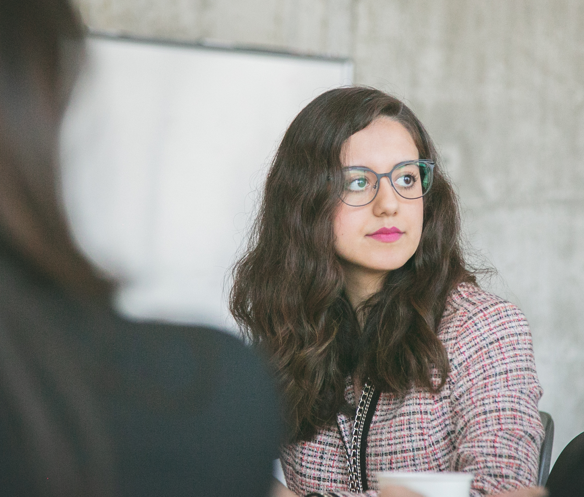 Woman with glasses focusing 