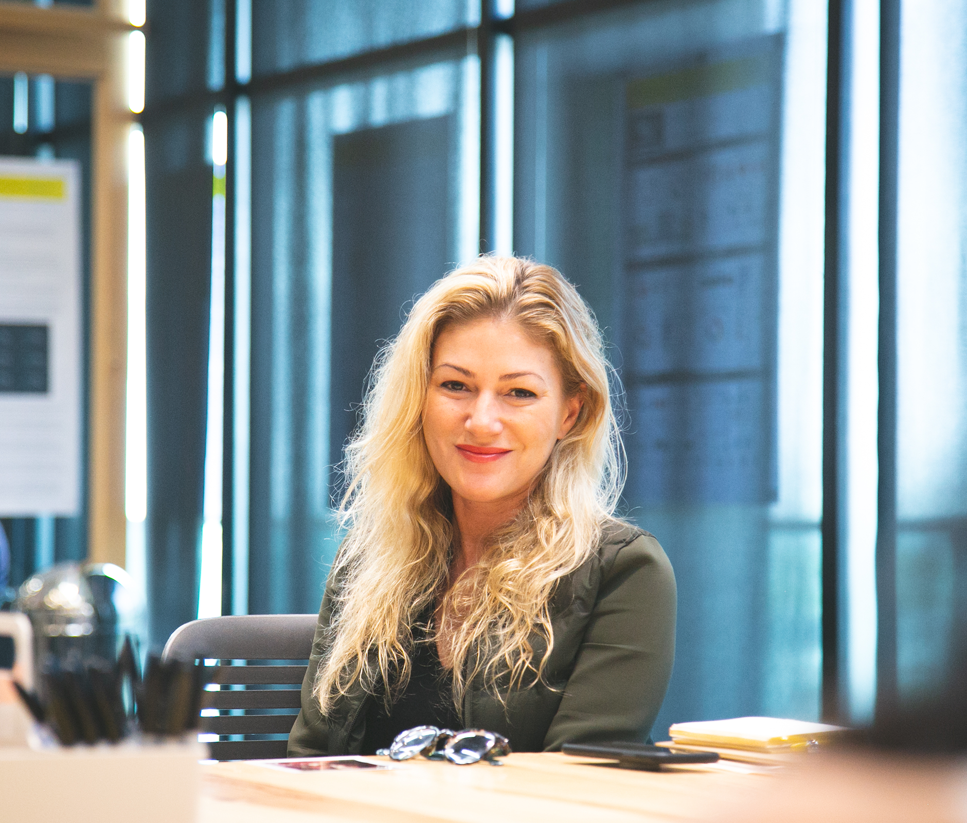 Blonde woman smiling at the camera 