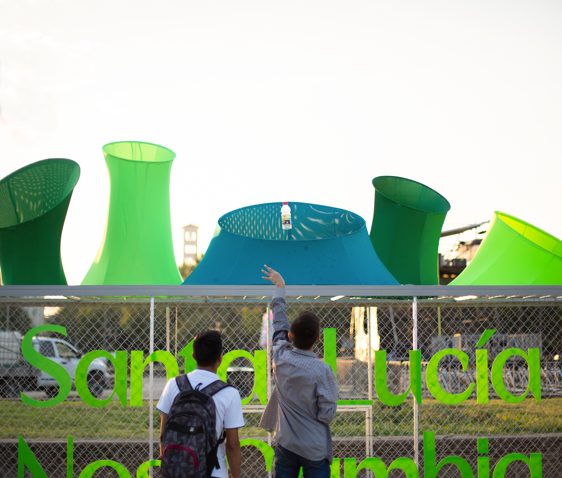 Guy tossing trash to recycle bin 