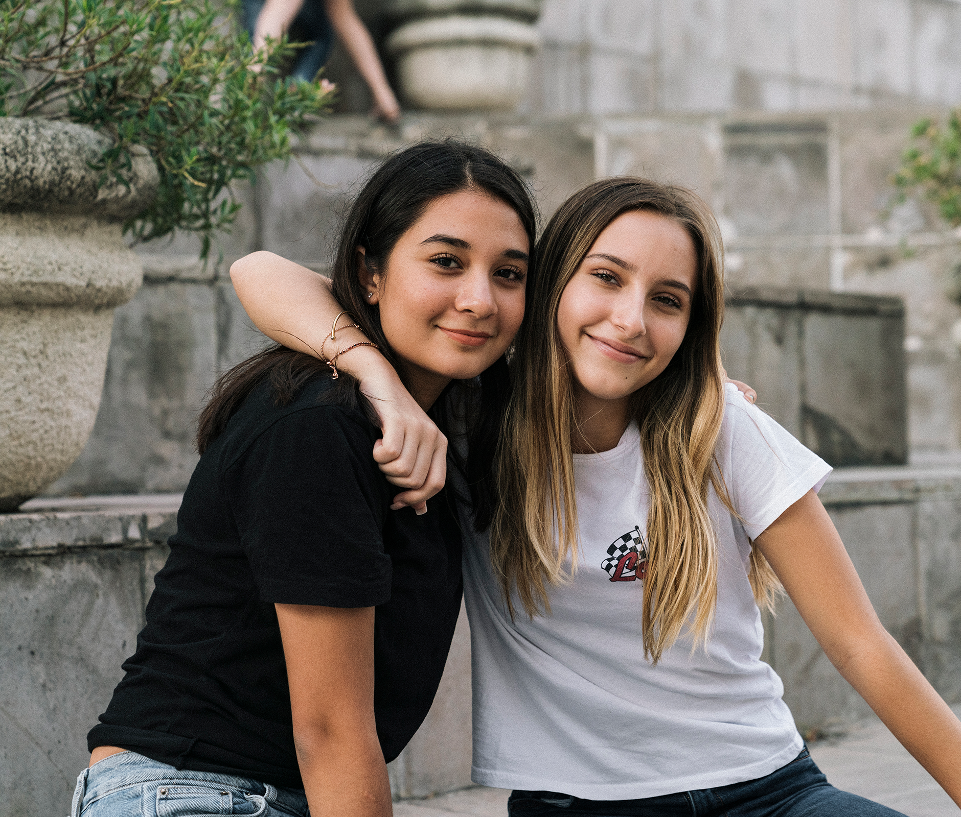 Teen hugging her best friend