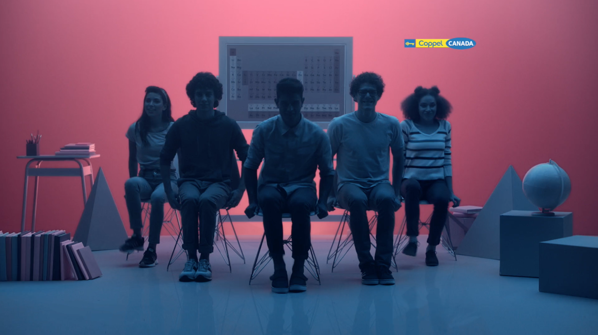 Students sitting in a colored room looking straight ahead