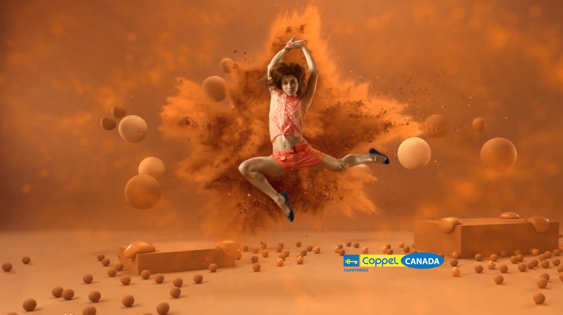 Teen jumping on orange background